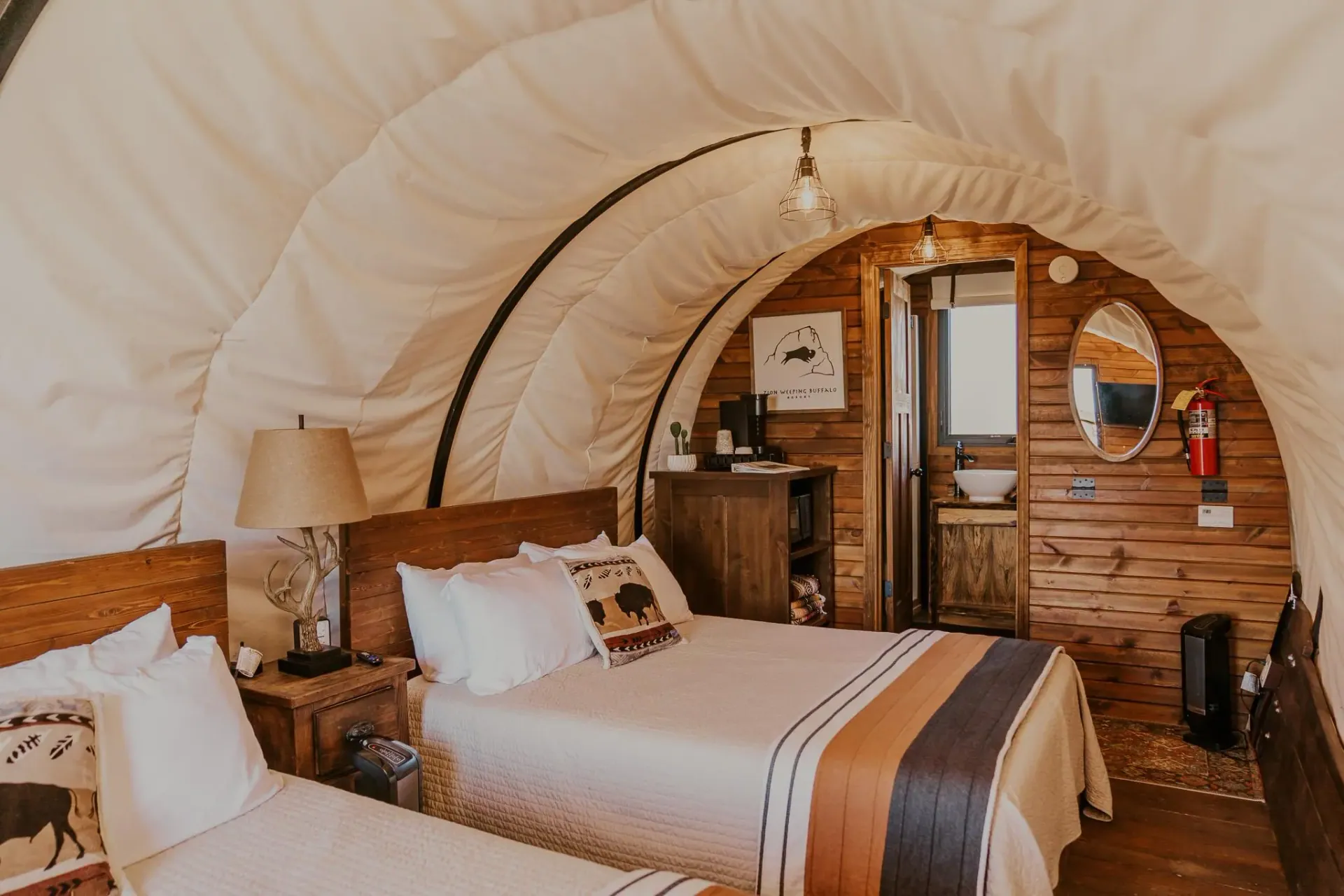 Covered wagon beds at Zion White Bison Resort